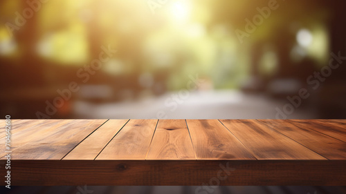 Empty wooden table with a blurry bokeh outdoor background, studio table for product design, background, table support