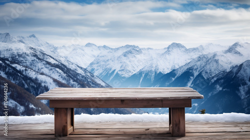 Empty wooden table to display products, empty wooden table in front of blurred snowy mountain background, winter packshot, beautiful nature in winter,