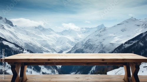 Empty wooden table to display products, empty wooden table in front of blurred snowy mountain background, winter packshot, beautiful nature in winter,