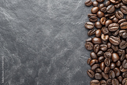 Premium roasted coffee beans on elegant black background ideal banner for coffee lovers and cafes © Ilja