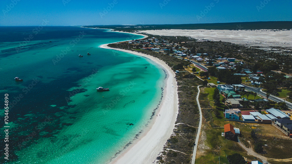Beautiful aerial view of turquoise ocean and white sandy beach on coastline of Lancelin - Western Australia.