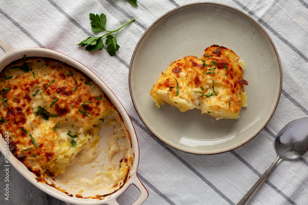 Homemade Scalloped Potatoes with Cheese and Parley, top view. Homemade Scalloped Potatoes with Cheese and Parley, top view.