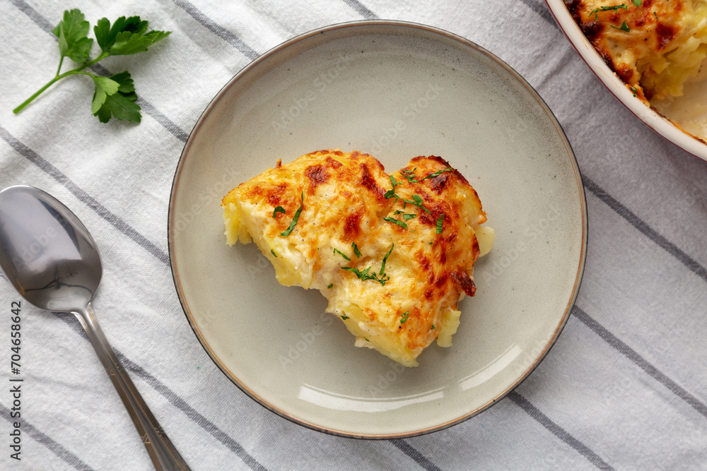 Homemade Scalloped Potatoes with Cheese and Parley, top view. Homemade Scalloped Potatoes with Cheese and Parley, top view.