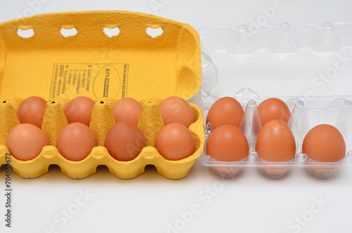 chicken eggs in plastic and cardboard packaging photo