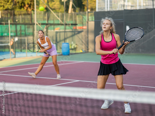 Tennis game — girl actively kicks the ball during a tennis game © JackF
