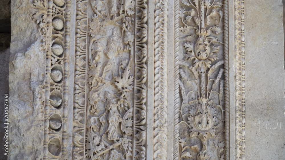 Stone carvings at the entrance to the ancient Roman Temple of Bacchus in Baalbek, Lebanon. Close-up capture. Stone carvings at the entrance to the ancient Roman Temple of Bacchus in Baalbek, Lebanon. Close-up capture.