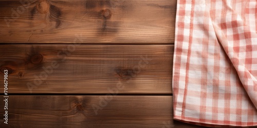 Wooden background with space for text, showcasing kitchen cloth.