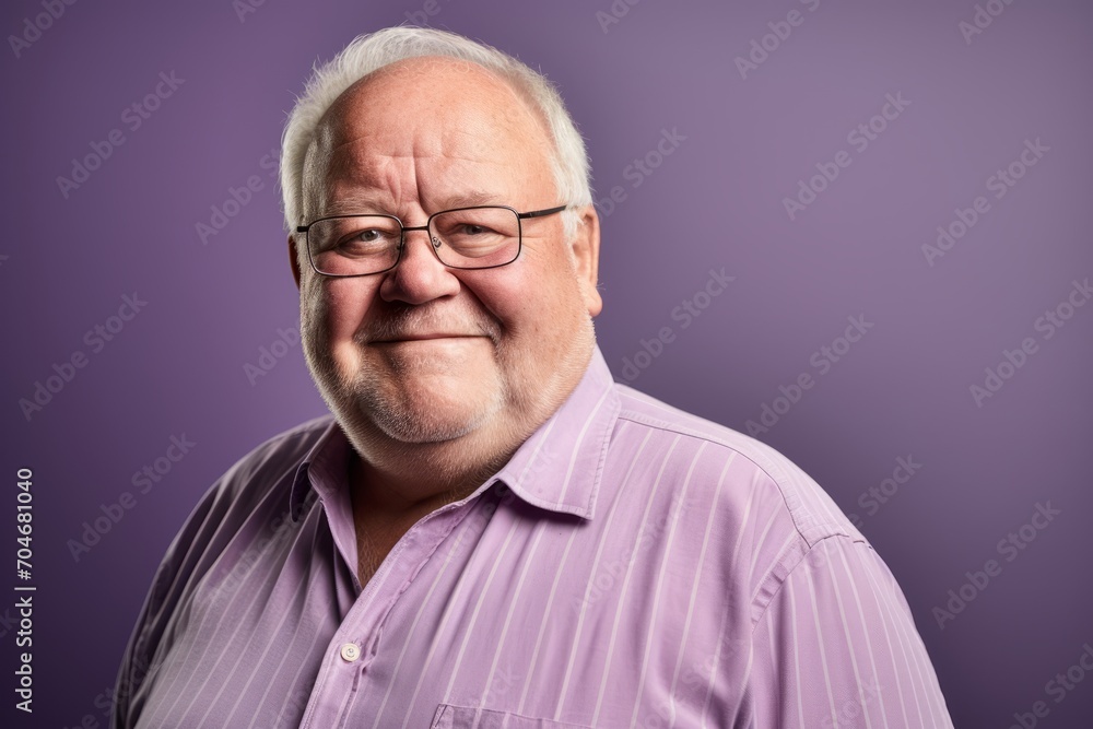 Portrait of a senior man with glasses on a purple background. Portrait of a senior man with glasses on a purple background.
