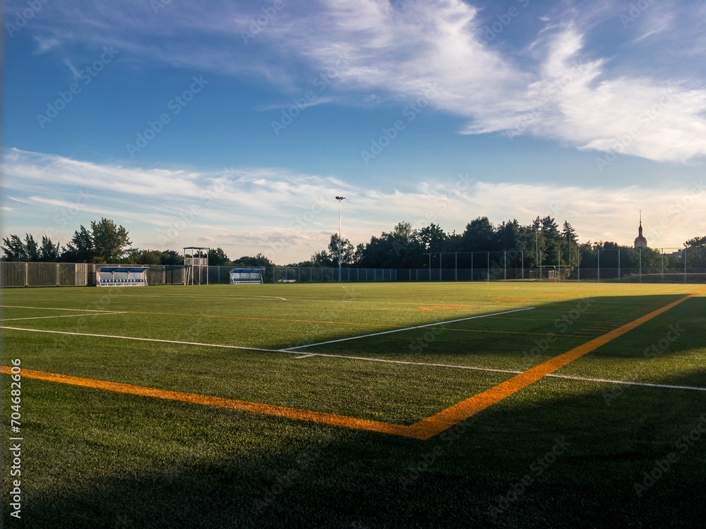Brand new football pitch at beautiful sunset