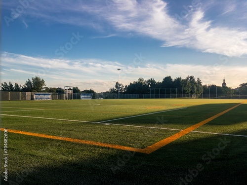 Brand new football pitch at beautiful sunset photo