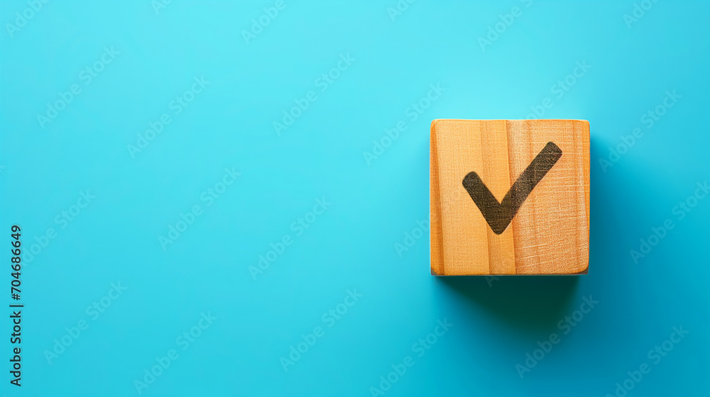 Checklist concept with copy space. Wood cube with check marks on blue background. Checklist concept with copy space. Wood cube with check marks on blue background.