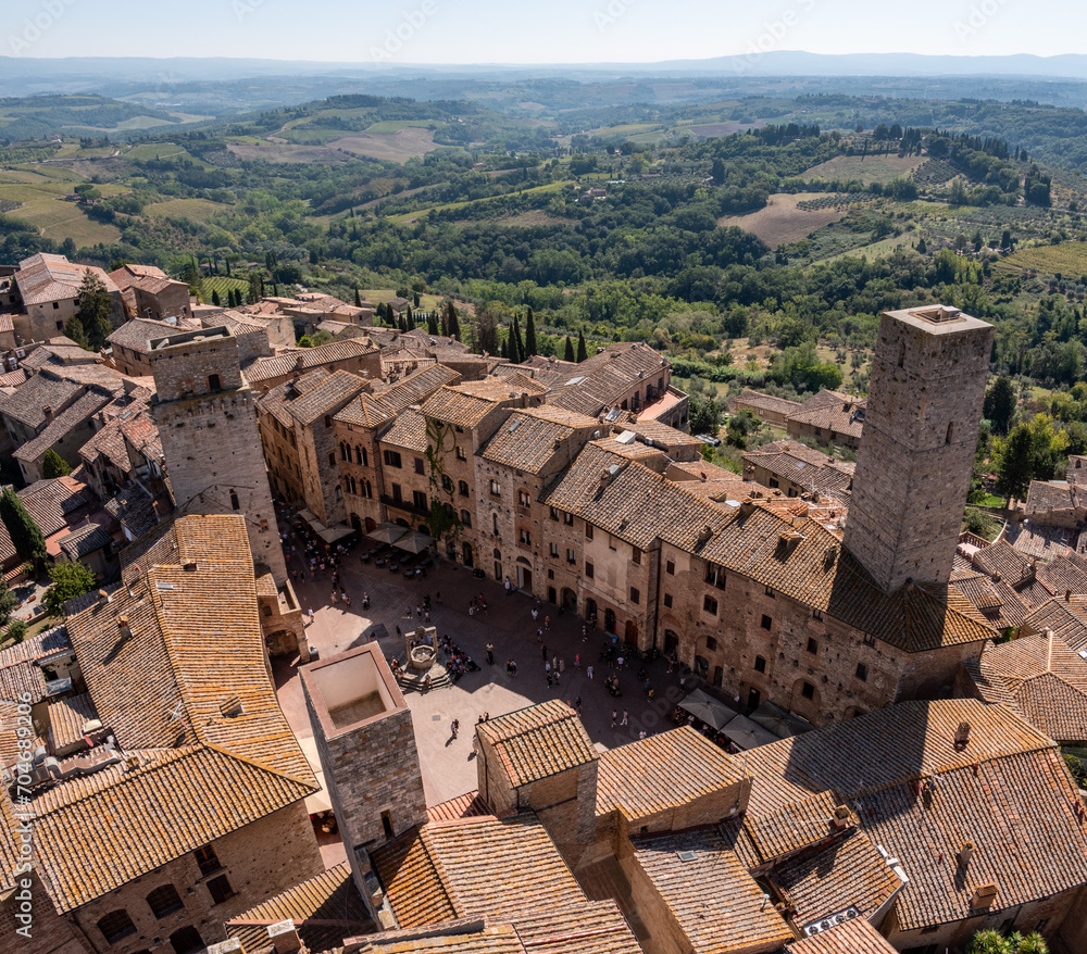 Wide panoramic view over downtown San Gimignano with Torre del Diavolo and Torre dei Becci, seen from Torre Grosso