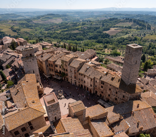 Wide panoramic view over downtown San Gimignano with Torre del Diavolo and Torre dei Becci, seen from Torre Grosso photo