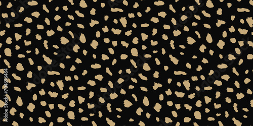 Abstract animal skin vector seamless pattern. Simple black and gold texture with brush spots, dots, strokes, organic shapes. Stylish golden background. Wild leopard print. Minimal luxury repeat design