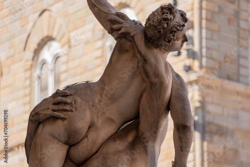 Statue of the Rape of the Sabines from artist Gimabologna in the Loggioa dei Lanzi in Florence photo