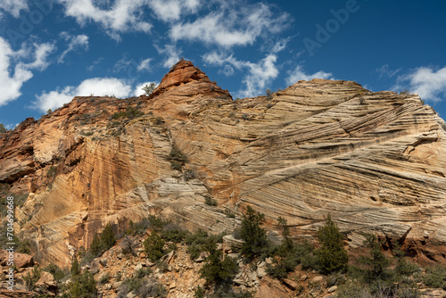 Scraping Texture Covers Wall Beneath Blue Sky In Zion