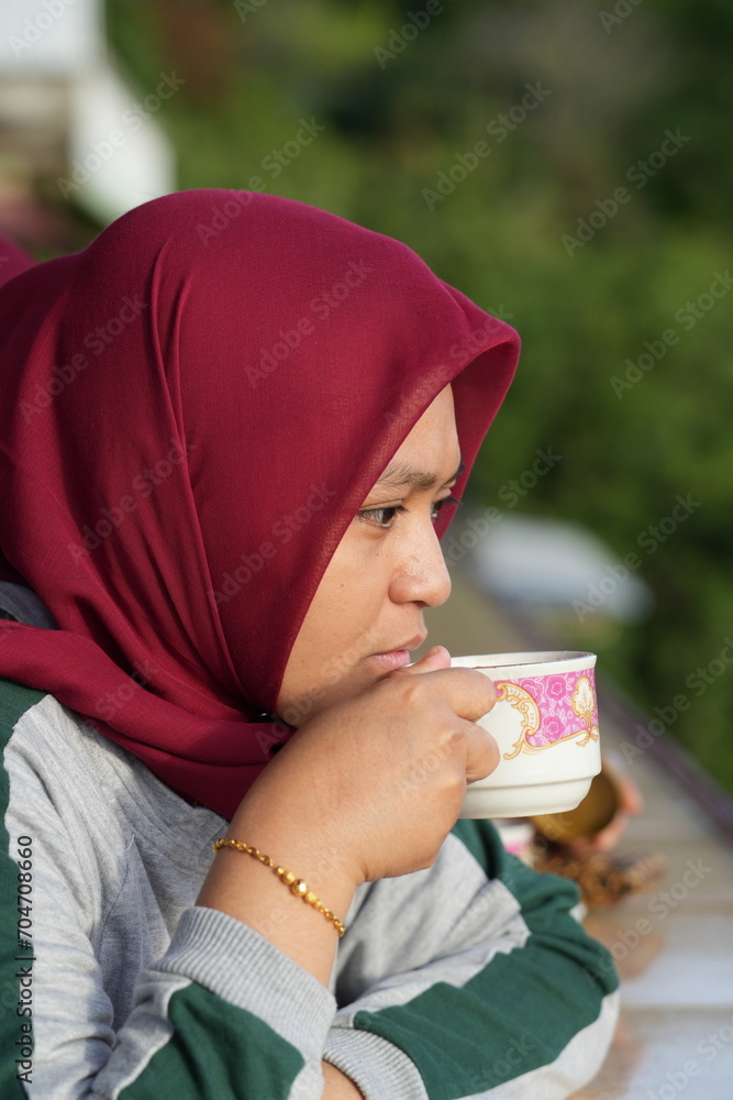 Woman is drinking tea in the morning Woman is drinking tea in the morning