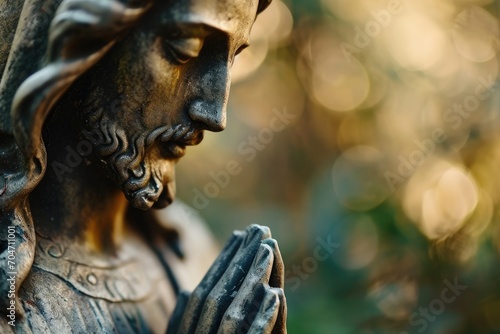 Macro of Jesus Christ statue in prayer, symbol of devotion and spirituality.