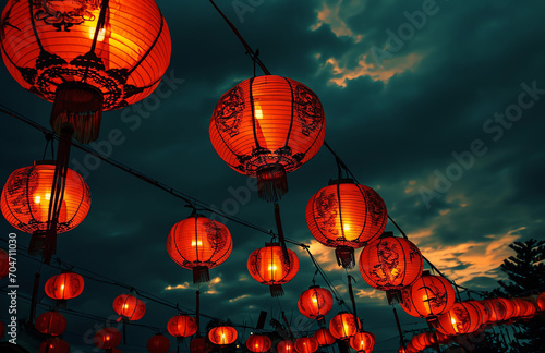 Red lanterns hanging from the sky at night