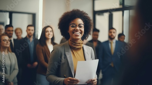 African young business woman in front of a group