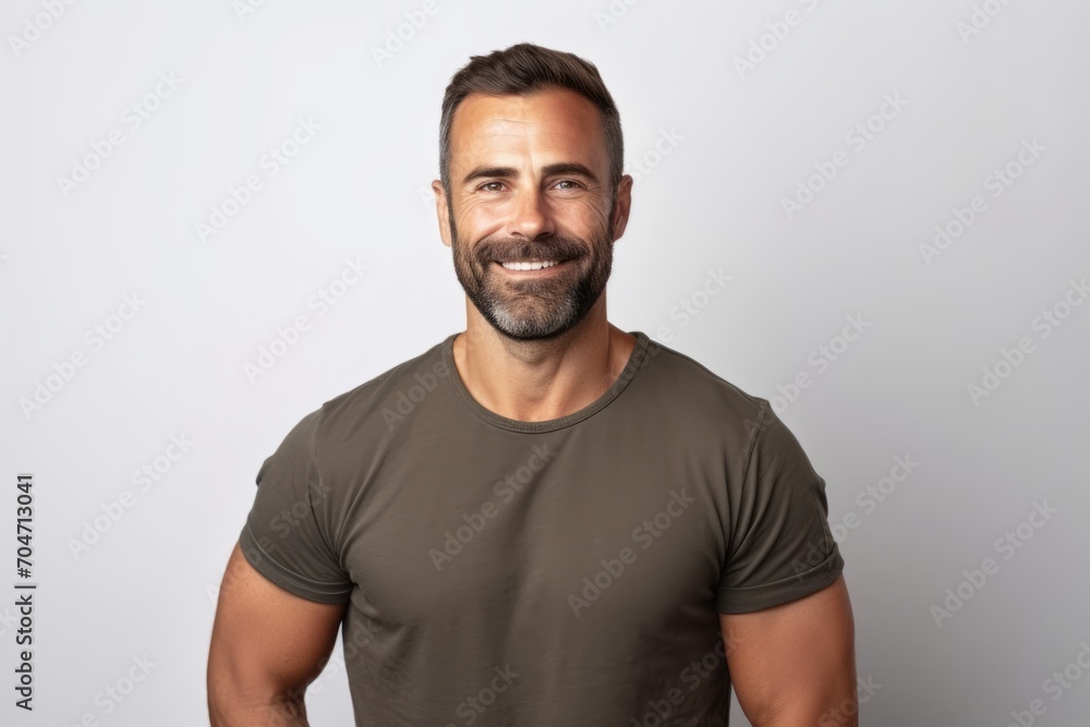 Handsome man in casual t-shirt smiling at camera. Handsome man in casual t-shirt smiling at camera.