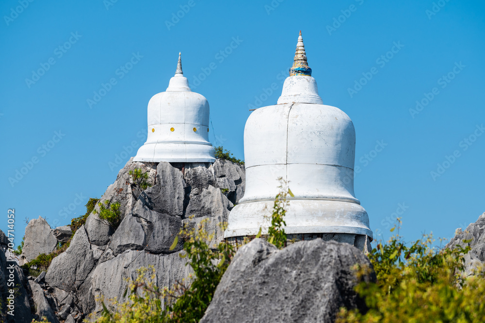 Group of the pagodas on limestone mountains in Wat Chaloem Phra Kiat Phrachomklao Rachanusorn in Lampang province of Thailand.