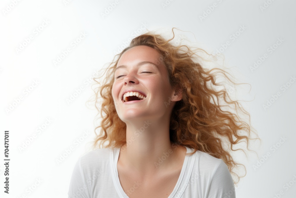 Happy young woman with curly hair laughing, isolated on white background. Happy young woman with curly hair laughing, isolated on white background.