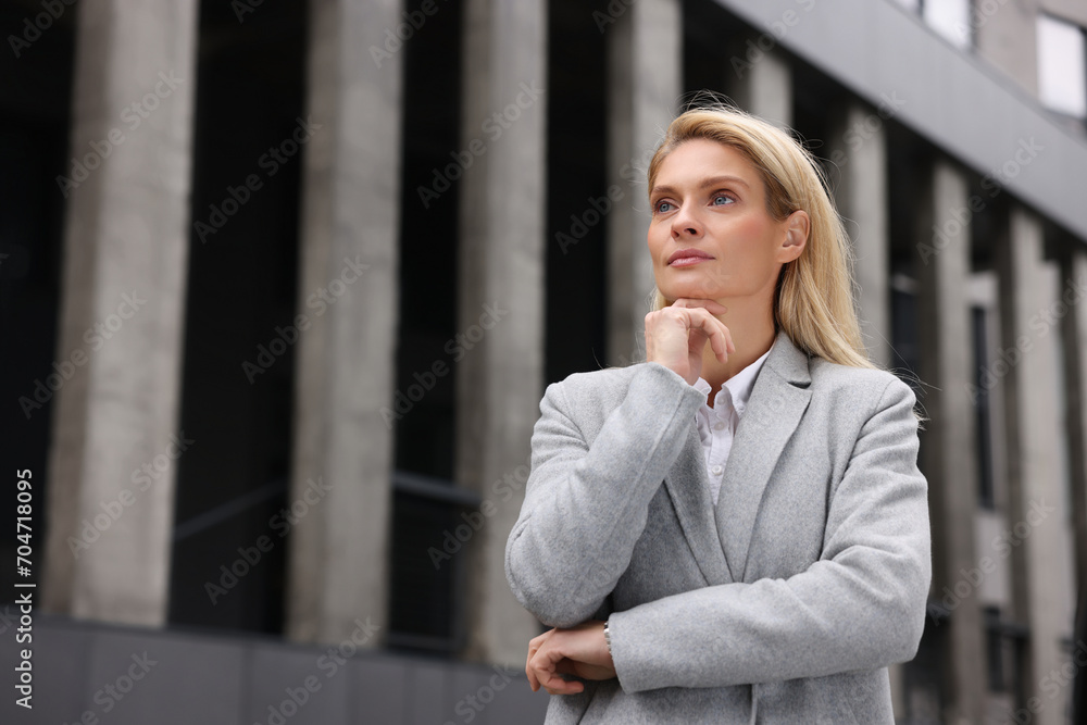 Portrait of thoughtful woman outdoors, space for text. Lawyer, businesswoman, accountant or manager Portrait of thoughtful woman outdoors, space for text. Lawyer, businesswoman, accountant or manager