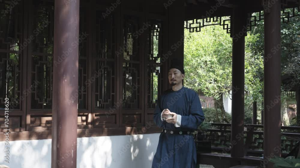 people in ancient costume drinking tea at porch people in ancient costume drinking tea at porch
