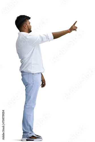 A man in a white shirt, on a white background, in full height, shows a forbidding sign, profile