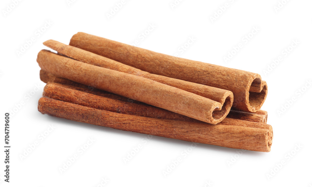 Pile of aromatic cinnamon sticks isolated on white Pile of aromatic cinnamon sticks isolated on white