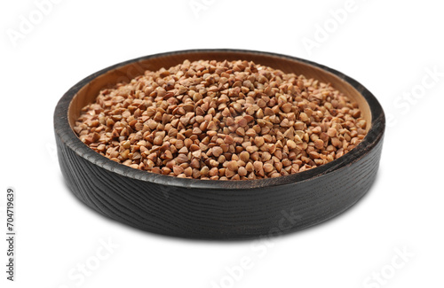 Bowl with dry buckwheat isolated on white