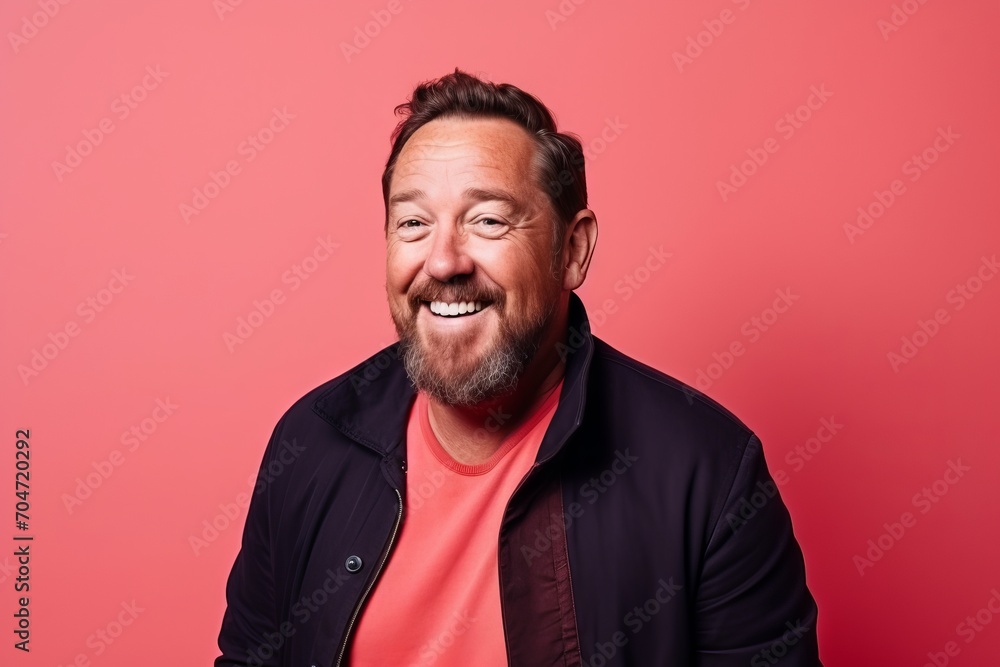 Portrait of a funny man with a beard on a red background. Portrait of a funny man with a beard on a red background.