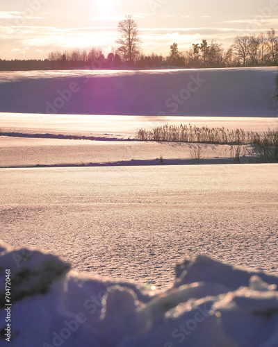 Scenic view of snow covered field during evening