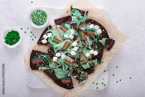 Fun chocolate bark for Saint Patricks day with green chocolate, rainbows and sprinkles
