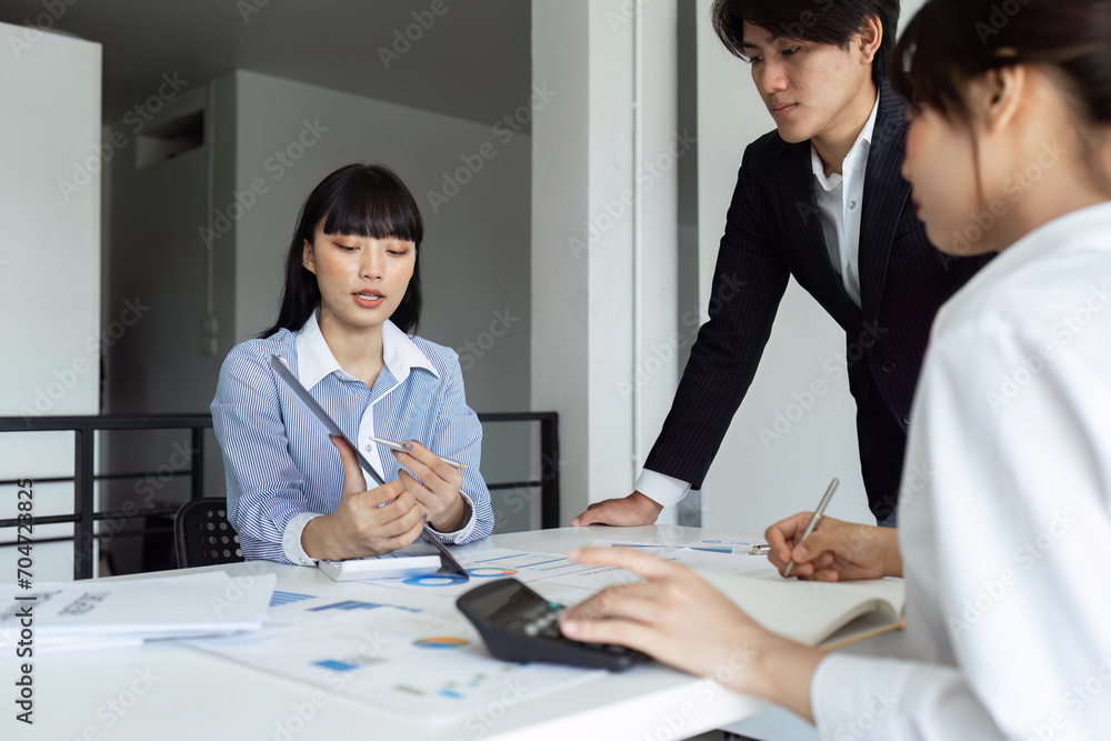 analyst team is doing teamwork and brainstorming about new strategy project at the meeting room. analyst team is doing teamwork and brainstorming about new strategy project at the meeting room.
