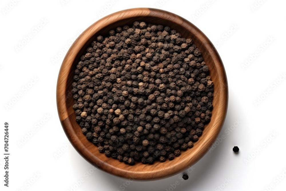 Black pepper in iron bowl isolated from above Black pepper in iron bowl isolated from above