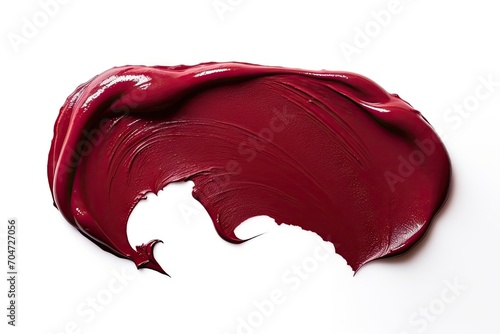 Burgundy red lipstick or acrylic paint texture isolated on white background