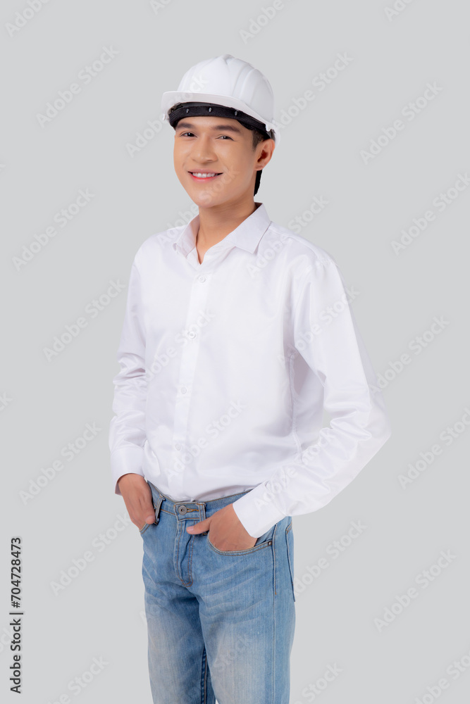 Portrait young asian man is engineer wearing helmet standing and smiling with confident isolated on white background, handsome male is architect or contractor, worker or labor, industrial concept. Portrait young asian man is engineer wearing helmet standing and smiling with confident isolated on white background, handsome male is architect or contractor, worker or labor, industrial concept.