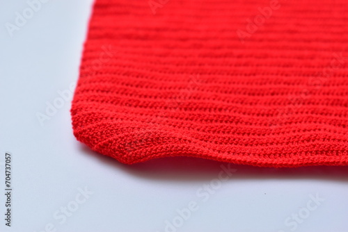 red wool knitted yarn texture  woolen fabric on white background