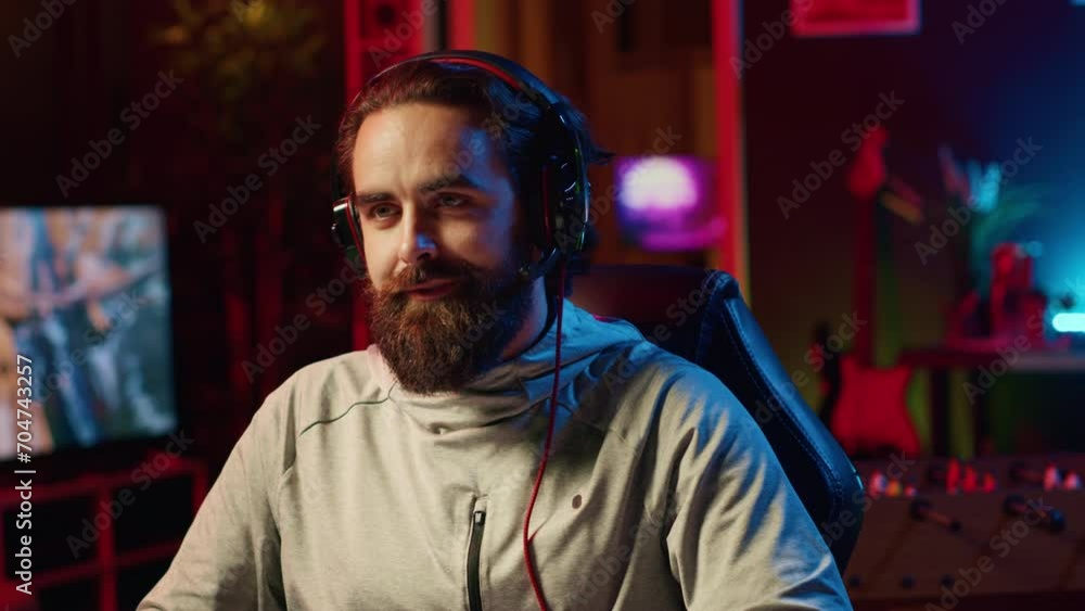 Man having burst of joy after defeating other players in videogame tournaments online while streaming on internet. Excited pro gamer winning esports contest during livestream with audience Man having burst of joy after defeating other players in videogame tournaments online while streaming on internet. Excited pro gamer winning esports contest during livestream with audience