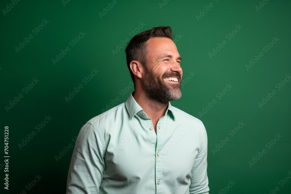 Portrait of a handsome man in shirt on a green background. Portrait of a handsome man in shirt on a green background.