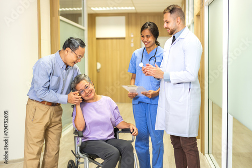 Man doctor with stethoscope service help support discussing and consulting care talk to sick senior asian woman patient in hospital,caregiver,elderly,recovery,illness insurance.healthcare and medicine