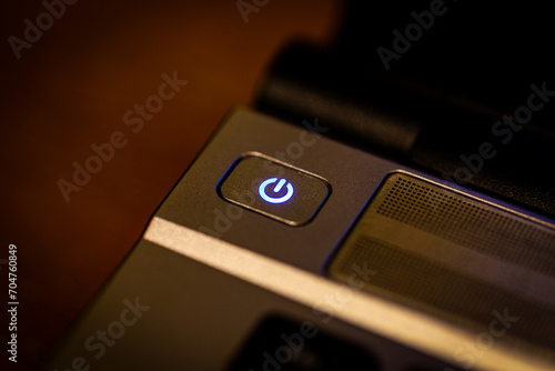 Power on off button with blue light © Thana