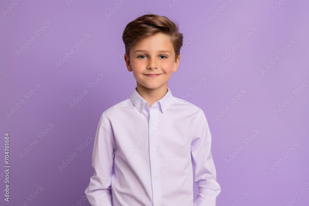 Portrait of a little boy in a white shirt on a purple background. Portrait of a little boy in a white shirt on a purple background.