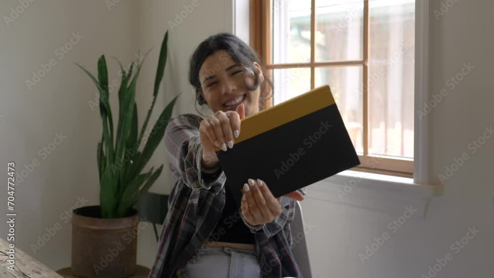 Joyful Puerto Rican girl looking at camera happy smiling gratitude with new reading book Joyful Puerto Rican girl looking at camera happy smiling gratitude with new reading book