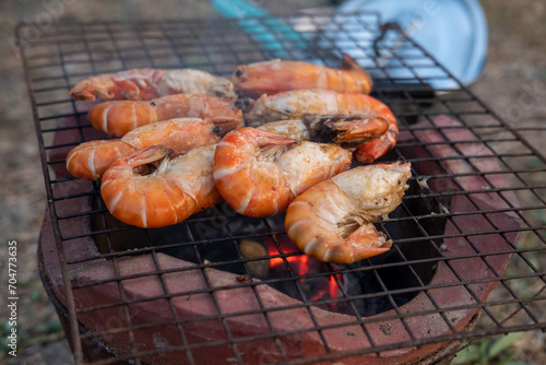 Grilled river prawns on a charcoal grill.