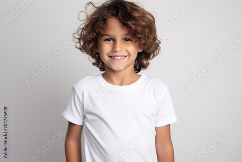 Portrait of a smiling little boy in a white t-shirt