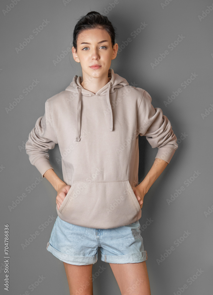 Pensive thoughtful young girl wearing sweatshirt with hood Pensive thoughtful young girl wearing sweatshirt with hood