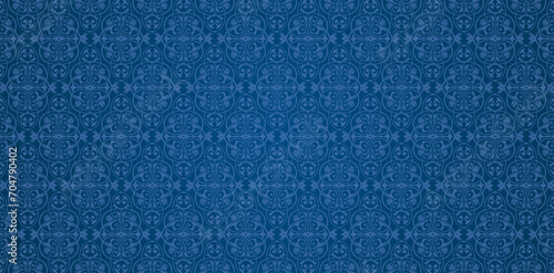 Seamless blue knitted fabric textured wallpapers with a patterns of curls and floral elements for textile wallpapers, books cover, Digital interfaces, prints templates material cards invitation, wraps
